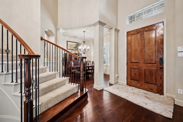 4651 Liam Dr, Frisco, TX 75034 - entryway with decorative columns, baseboards, a towering ceiling, and stairs