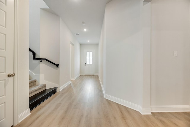 7113 El Matador Dr, Rowlett, TX 75088 - corridor with wood finished floors, baseboards, stairway, and recessed lighting