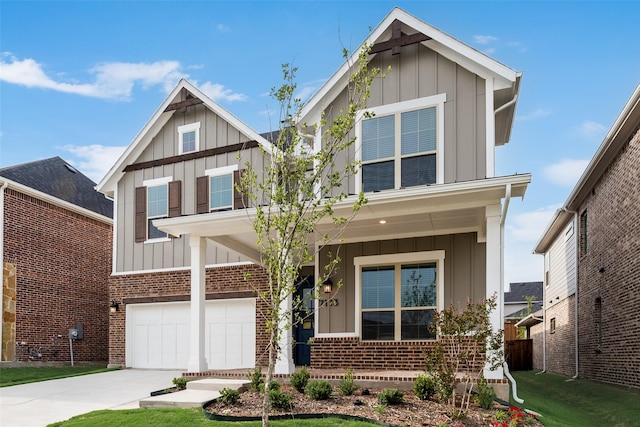 7113 El Matador Dr, Rowlett, TX 75088 - view of front facade featuring board and batten siding, an attached garage, and brick siding