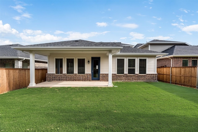 7113 El Matador Dr, Rowlett, TX 75088 - back of house featuring brick siding, a patio area, and a shingled roof