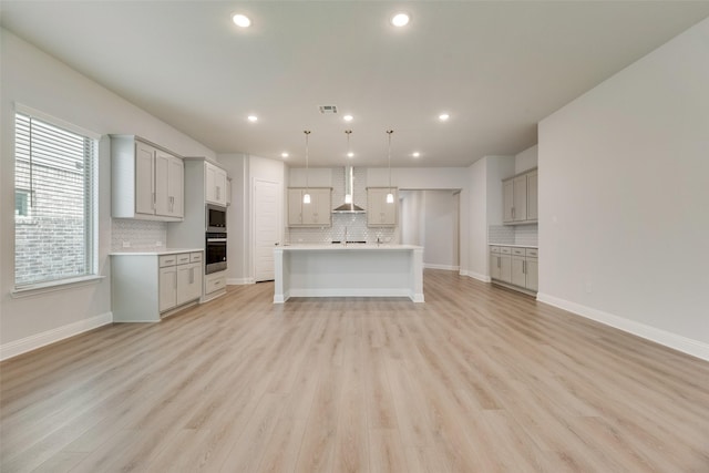 7113 El Matador Dr, Rowlett, TX 75088 - unfurnished living room featuring recessed lighting, light wood-type flooring, and baseboards