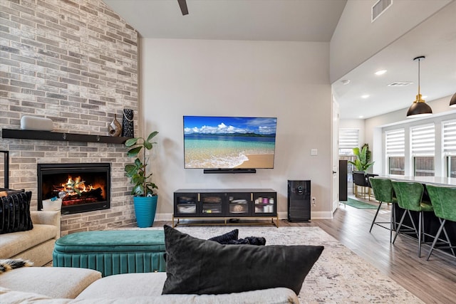 1806 Clouded Wren Dr, Arlington, TX 76005 - living room with wood finished floors, baseboards, a fireplace, and recessed lighting