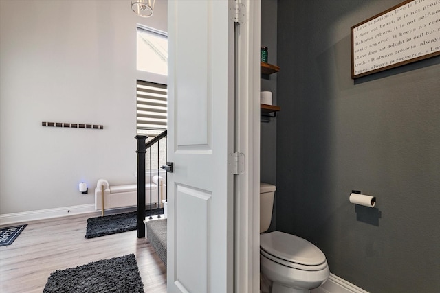 1806 Clouded Wren Dr, Arlington, TX 76005 - bathroom featuring wood finished floors, toilet, and baseboards