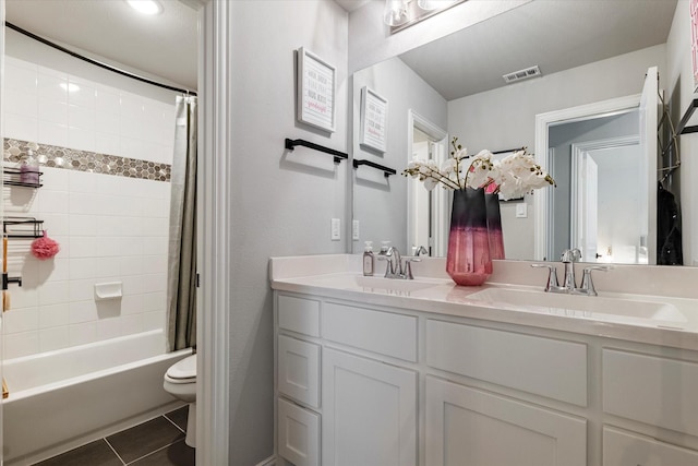 1806 Clouded Wren Dr, Arlington, TX 76005 - bathroom featuring tile patterned floors, double vanity, toilet, and shower / bath combo
