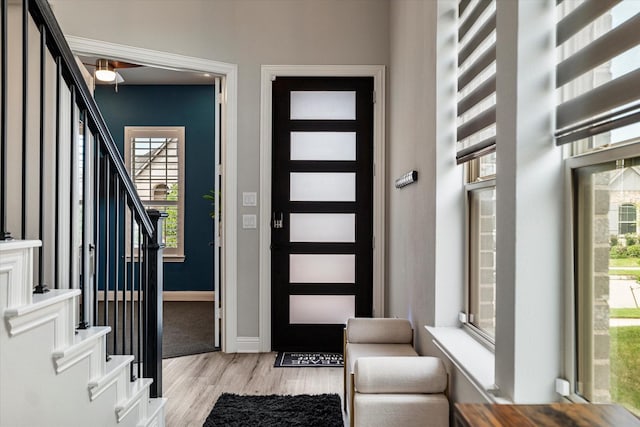 1806 Clouded Wren Dr, Arlington, TX 76005 - foyer with light wood finished floors, stairway, and baseboards