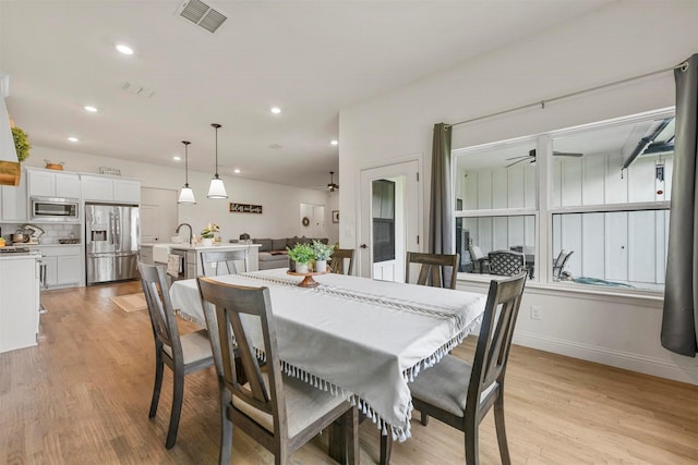 1511 Horseshoe Ct, Justin, TX 76247 - dining area with ceiling fan, light wood finished floors, recessed lighting, and baseboards
