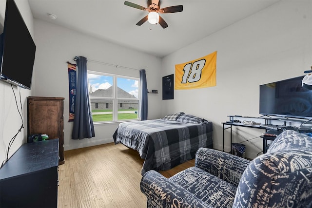 1511 Horseshoe Ct, Justin, TX 76247 - bedroom featuring wood finished floors, baseboards, and ceiling fan