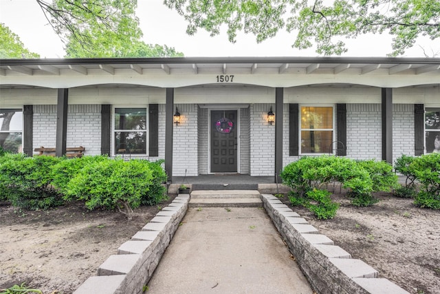1507 Greenbrier Dr, Sherman, TX 75092 - property entrance featuring covered porch and brick siding