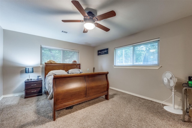 1507 Greenbrier Dr, Sherman, TX 75092 - carpeted bedroom featuring multiple windows, baseboards, and a ceiling fan