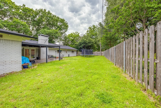 1507 Greenbrier Dr, Sherman, TX 75092 - view of yard with a trampoline, french doors, and a patio