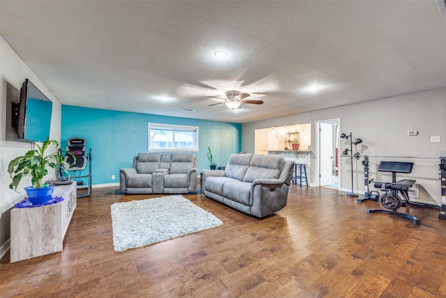 1507 Greenbrier Dr, Sherman, TX 75092 - living area with ceiling fan, wood finished floors, recessed lighting, a textured ceiling, and baseboards