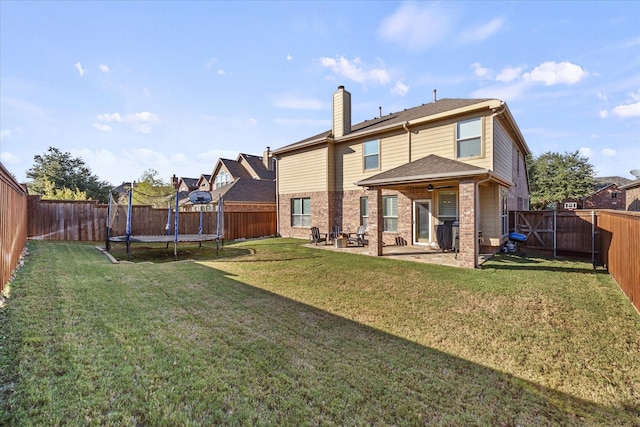 615 Louder Way, Fate, TX 75087 - rear view of property with a patio area, a chimney, a trampoline, brick siding, and a ceiling fan