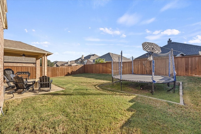 615 Louder Way, Fate, TX 75087 - view of yard featuring a trampoline, a ceiling fan, and a patio area