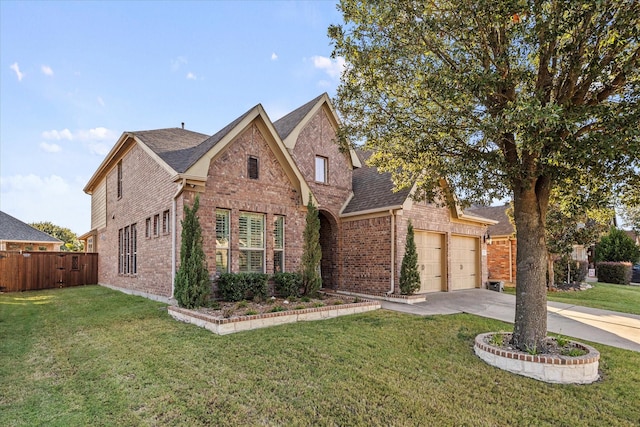 615 Louder Way, Fate, TX 75087 - traditional-style house with brick siding, concrete driveway, roof with shingles, and an attached garage