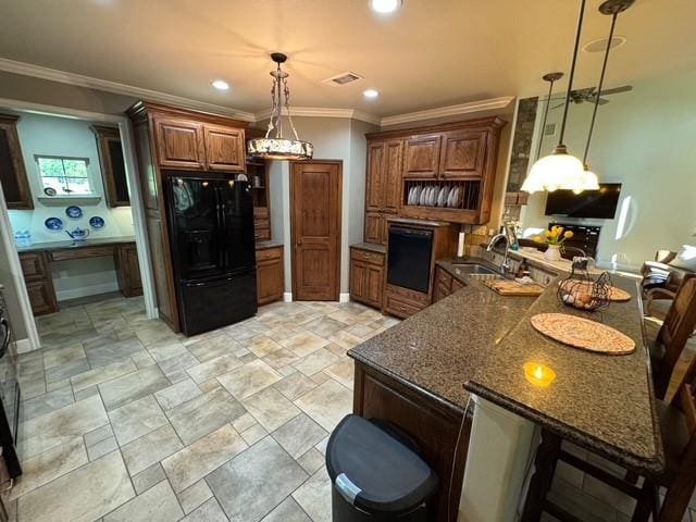 255 Chaparrals Run, Azle, TX 76020 - kitchen featuring black fridge, wall oven, a sink, crown molding, and a peninsula