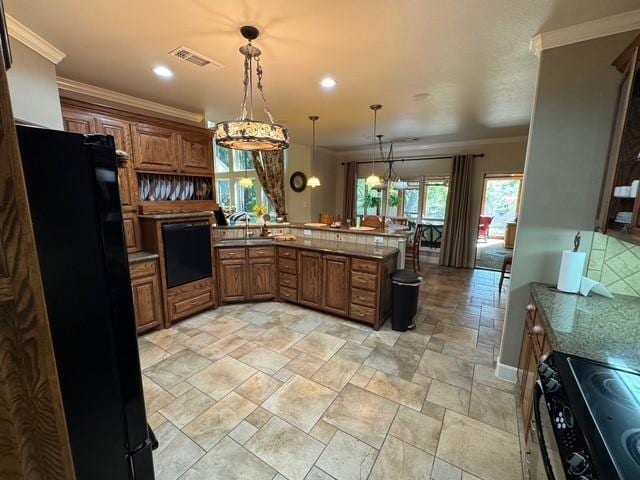 255 Chaparrals Run, Azle, TX 76020 - kitchen featuring black appliances, brown cabinets, light stone finish flooring, a peninsula, and recessed lighting