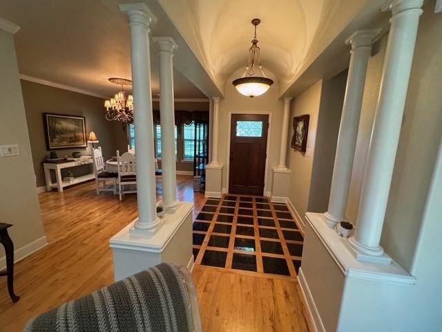 255 Chaparrals Run, Azle, TX 76020 - entryway with baseboards, wood finished floors, a chandelier, and ornamental molding