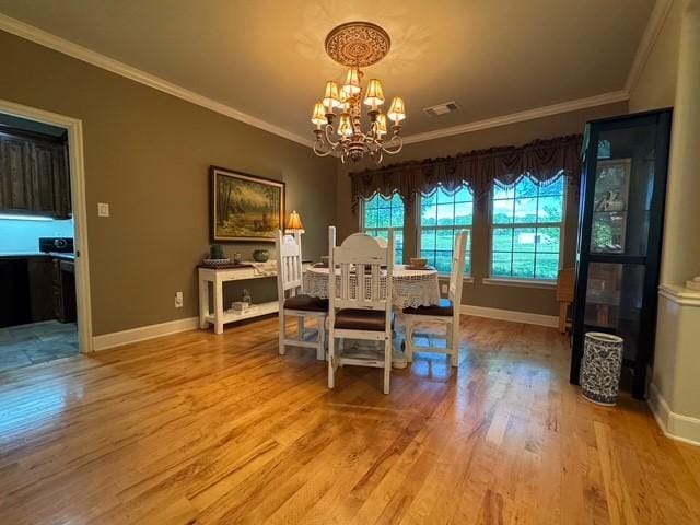 255 Chaparrals Run, Azle, TX 76020 - dining space with a chandelier, ornamental molding, light wood finished floors, and baseboards