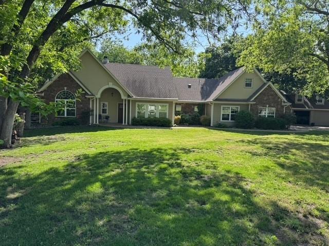 255 Chaparrals Run, Azle, TX 76020 - view of front facade with a front yard