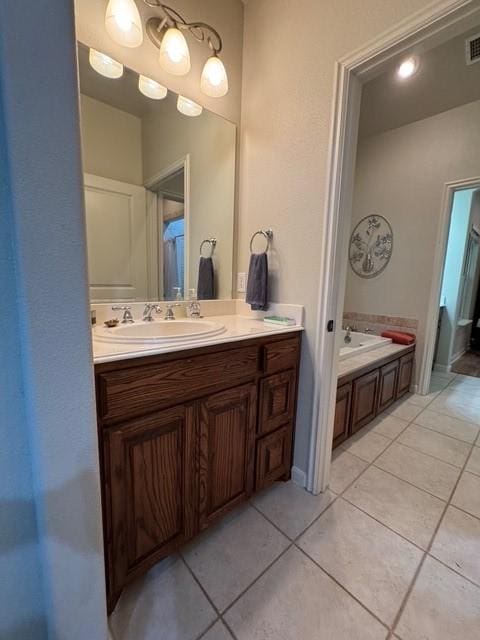 255 Chaparrals Run, Azle, TX 76020 - bathroom featuring tile patterned flooring, vanity, and a bath
