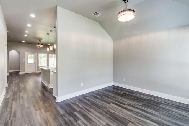 3235 Pine St, Dallas, TX 75215 - spare room with arched walkways, dark wood-type flooring, recessed lighting, and baseboards
