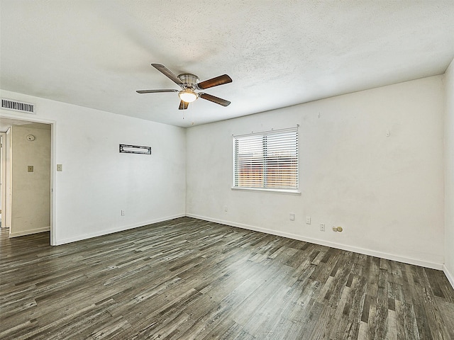 5632 Twitty St, The Colony, TX 75056 - spare room with wood finished floors, ceiling fan, baseboards, and a textured ceiling