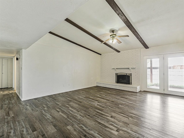 5632 Twitty St, The Colony, TX 75056 - unfurnished living room with a ceiling fan, dark wood-type flooring, a brick fireplace, and baseboards