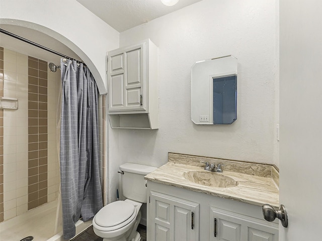 5632 Twitty St, The Colony, TX 75056 - bathroom with toilet, vanity, and a shower stall