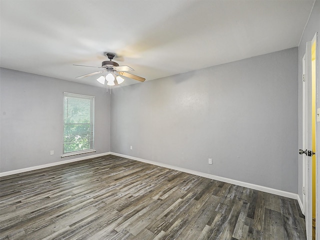 5632 Twitty St, The Colony, TX 75056 - empty room featuring dark wood-type flooring, a ceiling fan, and baseboards