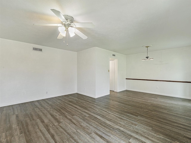 5632 Twitty St, The Colony, TX 75056 - unfurnished living room with a ceiling fan, wood finished floors, and baseboards