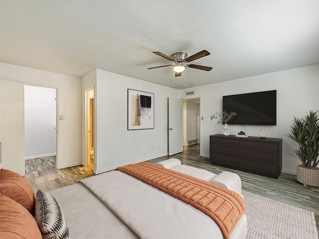 5632 Twitty St, The Colony, TX 75056 - bedroom with wood finished floors, baseboards, and a ceiling fan