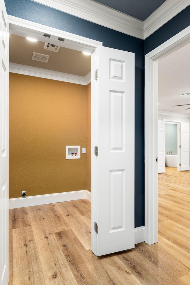 9916 Sandalwood Dr, Woodway, TX 76712 - washroom with hookup for a washing machine, ornamental molding, wood finished floors, and baseboards