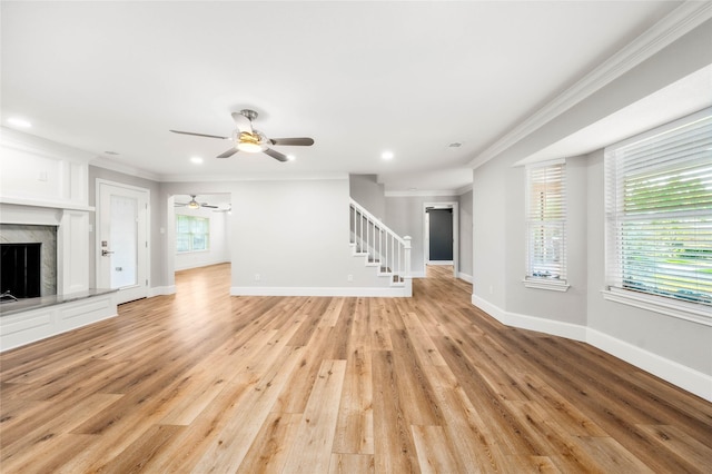 9916 Sandalwood Dr, Woodway, TX 76712 - unfurnished living room featuring ornamental molding, stairway, a ceiling fan, light wood finished floors, and baseboards