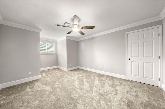 9916 Sandalwood Dr, Woodway, TX 76712 - carpeted spare room with a ceiling fan, crown molding, baseboards, and a textured ceiling