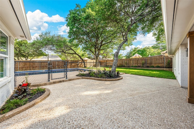 9916 Sandalwood Dr, Woodway, TX 76712 - view of patio featuring a fenced backyard and a gate
