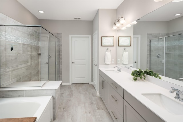 1619 Temperance Way, Wylie, TX 75098 - bathroom with a stall shower, double vanity, a garden tub, and recessed lighting