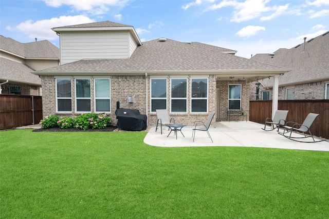 1619 Temperance Way, Wylie, TX 75098 - rear view of property with brick siding, a patio, and roof with shingles