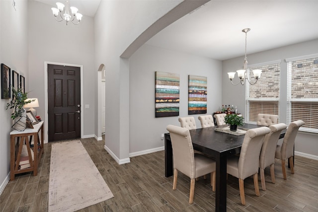 1619 Temperance Way, Wylie, TX 75098 - dining room with a chandelier, arched walkways, and wood finished floors