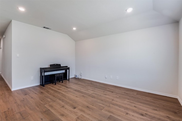 6534 Diver St, Princeton, TX 75407 - empty room with lofted ceiling, wood finished floors, baseboards, and recessed lighting