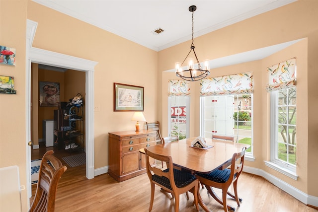 404 High Meadow Ln, Heath, TX 75032 - dining room featuring light wood-style flooring, a chandelier, baseboards, and crown molding