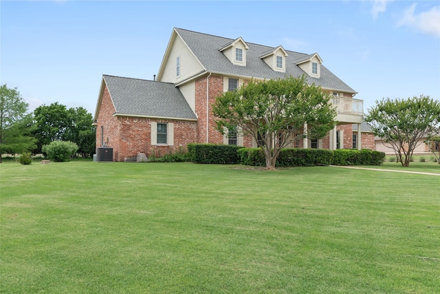 404 High Meadow Ln, Heath, TX 75032 - view of front facade with brick siding, a front lawn, a shingled roof, and central air condition unit