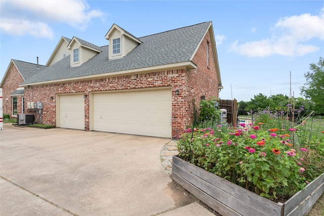 404 High Meadow Ln, Heath, TX 75032 - view of side of property with brick siding, a shingled roof, and a garage