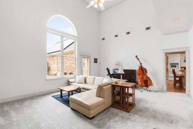 404 High Meadow Ln, Heath, TX 75032 - living area featuring high vaulted ceiling, light carpet, ceiling fan, and baseboards