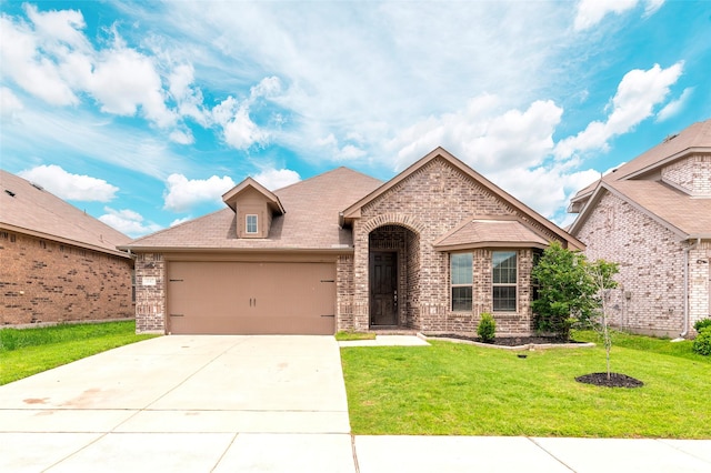 4142 Perch Dr, Forney, TX 75126 - french provincial home with brick siding, a front lawn, an attached garage, and concrete driveway