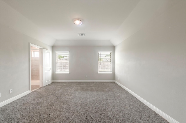 4142 Perch Dr, Forney, TX 75126 - empty room featuring carpet, vaulted ceiling, and baseboards