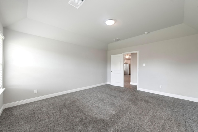 4142 Perch Dr, Forney, TX 75126 - unfurnished room with dark carpet, baseboards, and lofted ceiling
