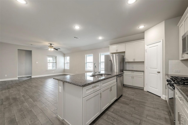 4142 Perch Dr, Forney, TX 75126 - kitchen with stainless steel appliances, a sink, dark wood finished floors, ceiling fan, and recessed lighting