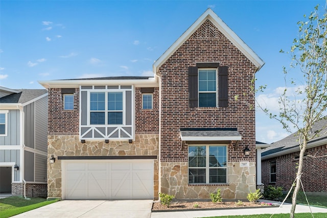 7107 Manhattan Dr, Rowlett, TX 75088 - view of front facade with stone siding, a garage, driveway, and brick siding