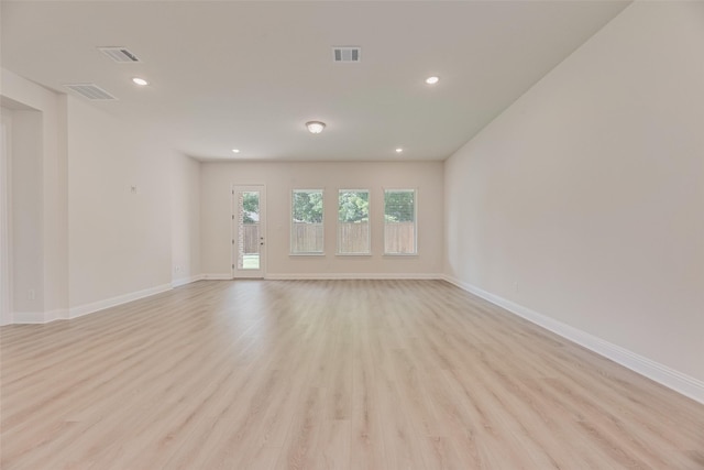 7107 Manhattan Dr, Rowlett, TX 75088 - spare room featuring light wood-style floors, recessed lighting, and baseboards