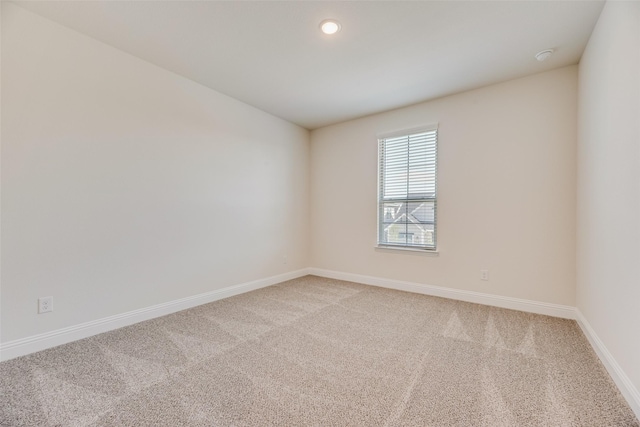 7107 Manhattan Dr, Rowlett, TX 75088 - spare room featuring light colored carpet, baseboards, and recessed lighting